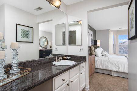 Master suite bathroom with granite countertops