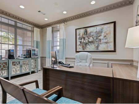Desk and seating in leasing office   | The Rocca Apartments in Atlanta, GA