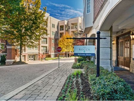 Street view of apartment with signage  | The Rocca Apartments in Atlanta, GA