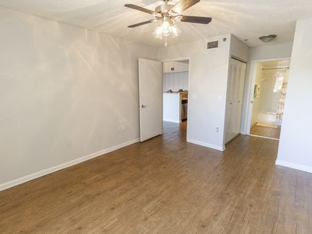 Master bedroom with attached bathroom , large closets and wood flooring throughout