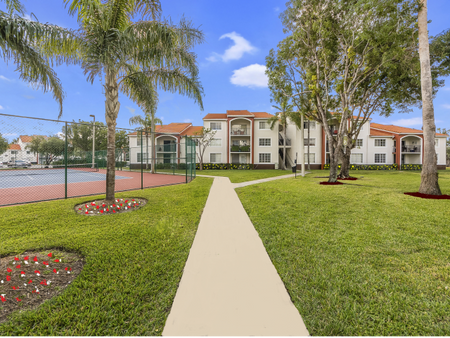 Paved sidewalks for easy walking access throughout community, large trees and open grassy areas. Large fenced-in tennis court area is centrally located near apartment buildings
