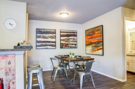Bellevue West Apartments Separate Dining Room Next to Kitchen with Wood-Style Flooring