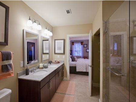 Classical bathroom with tile flooring and double sinks | The Rocca Apartments in Atlanta, GA