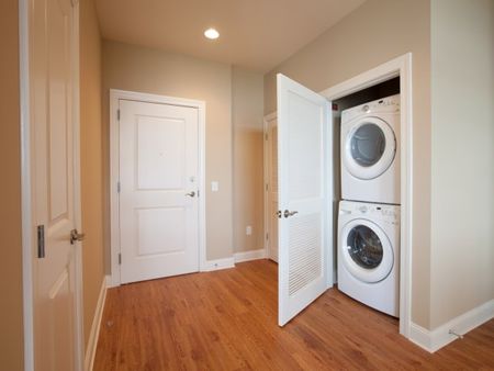 Double washer and dryer in the hallway | The Rocca Apartments in Atlanta, GA