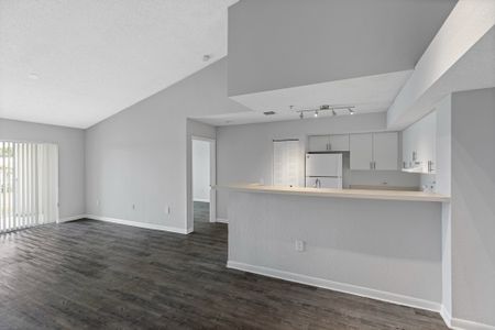 Spacious open floor plan apartment homes with wood like flooring throughout