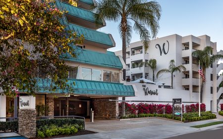 front view of the entrance to the four story warwick apartment building