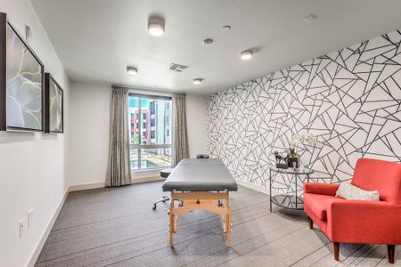 room with massage table at arte apartments