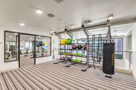 State-of-the-Art Two-Story Fitness Center with Spin/Yoga Room with Wellbeats