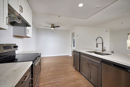 renovated kitchen with stainless steel appliances, updated cabinets and countertops