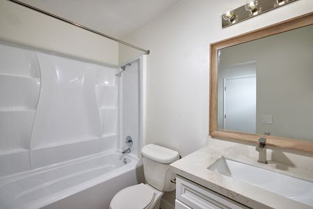 updated bathroom with new cabinets and countertops