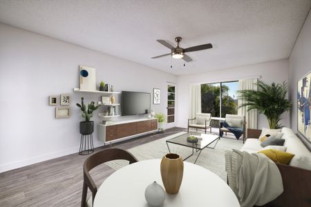 Dining and living area virtually staged with ceiling fan