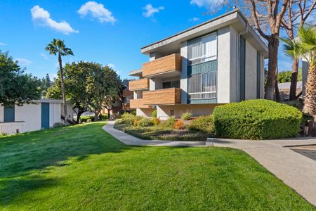 Lush green landscaping at Trolley Palm Apartments