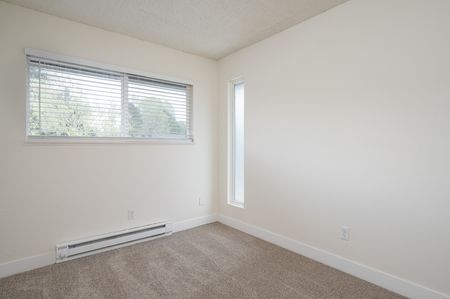 bedroom with carpet and large window
