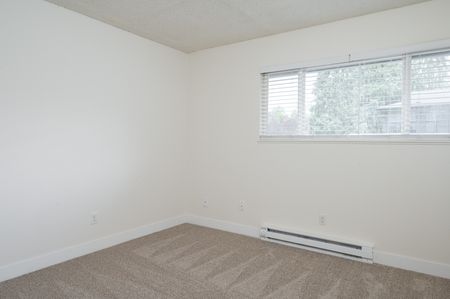 bedroom with carpet and sliding door closet