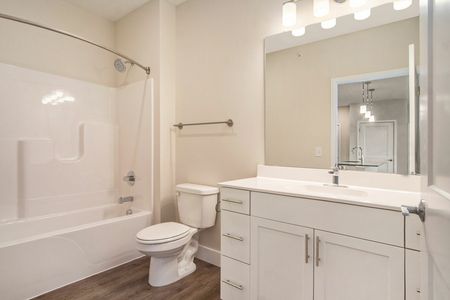 Modern bathroom including bronze fixtures
