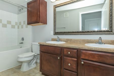 bathroom with brown counters