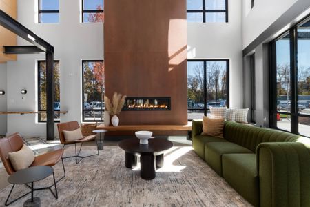 Comfortable seating, fire feature, and coffee bar in lobby at West End Yards | Apartments In Portsmouth