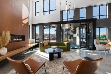 Lobby - seating, pendant lighting, large windows at West End Yards | Apartments In Portsmouth, NH for Rent