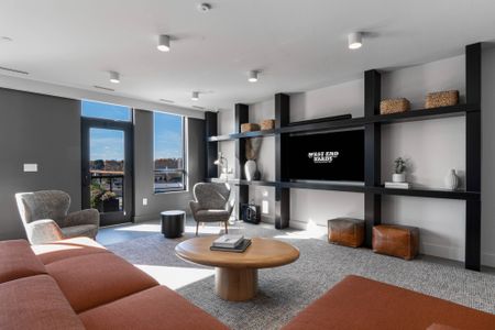 Seating and media in rooftop lounge at West End Yards | Portsmouth Apartments