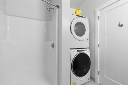 Spacious Bathroom with stacked washer & dryer at  West End Yards | Apartments In Portsmouth