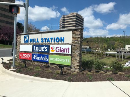 Neighborhood retail sign for businesses right around the corner from The View at Mill Run | Apartments in Owings Mills