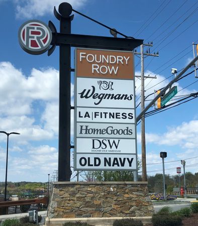 Neighborhood retail  sign for businesses right around the corner from The View at Mill Run | Apartments in Owings Mills, MD