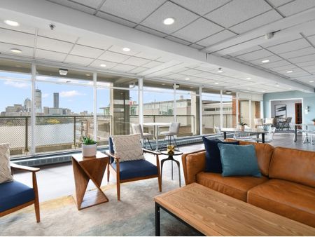 Comfortable seating in skyroom at 100 Memorial Drive | Apartments in Cambridge