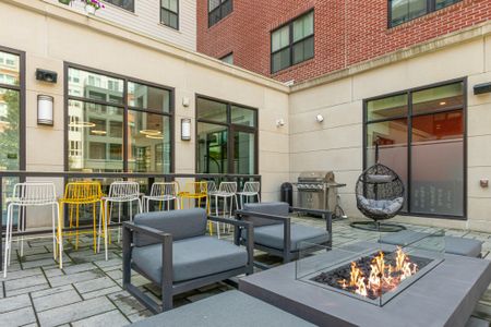 Fire feature and seating in the courtyard - The Flats at 131 | Apartments in Beverly, MA