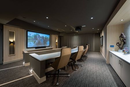 Representational Image of screening lounge of HD projector and cinema-style seating