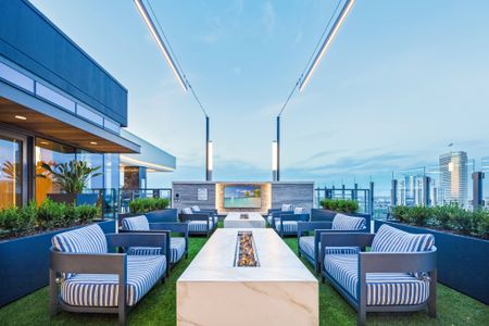 24th floor outdoor lounge with floating fireplace, lounge seating, grilling stations and firepits