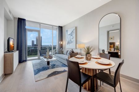 Stunning engineered hardwood flooring and floor-to-ceiling windows
