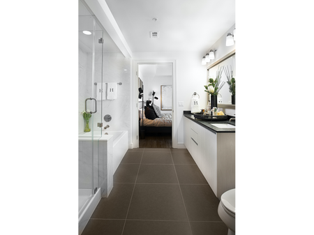 En-suite bathroom with walk-in glass shower, white marble bathtub and wall tiling, tile floor, and black-granite-topped dual vanity.