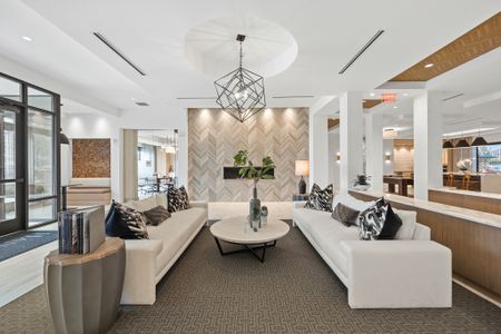 Resident lobby with ample seating, fireplace and flexible coworking space