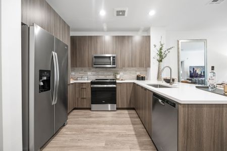 Chef-inspired kitchen with premium granite and quartz countertops with full-height backsplashes, Italian cabinets with soft close drawers and premium appliance packages