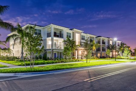 The Reserve at Coral Springs, exterior, night, brightly lit apartments with balconies