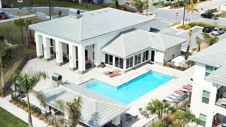 The Reserve at Vero Beach, exterior, aerial view, clubhouse, sparkling blue pool