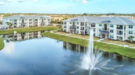 The Reserve at Vero Beach, exterior, aerial view of pond, fountain, 2 buildings