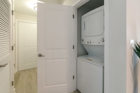 The Reserve at Vero Beach, interior, hallway laundry closet, white stack-able washer and dryer