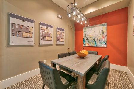 The Reserve at Vero Beach, interior, conference room, orange accent wall, dining table, chairs