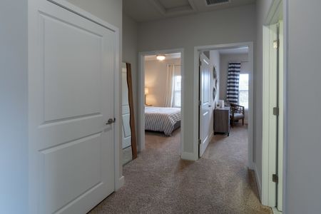 The Reserve at Coral Springs, interior, carpeted hallway to bedrooms