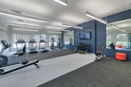 The Reserve at Coral Springs, interior, fitness center, rowing machine, treadmills, hand weights, elliptical