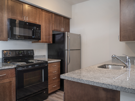 Stainless Steel and Black Kitchen Appliances l Luxury Apartments for Rent l Fife, WA l Port Landing