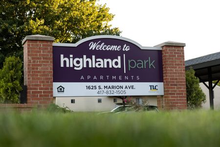 Highland Park brick apartment sign