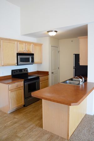 Battlefield Park Apartments interior image of kitchen with plan flooring