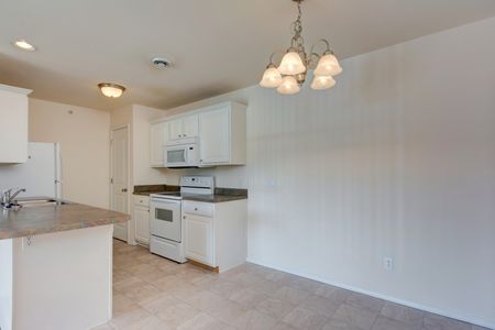 Battlefield Park kitchen with white cabinets and appliances