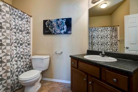 Coryell Courts apartments guest bathroom, furnished