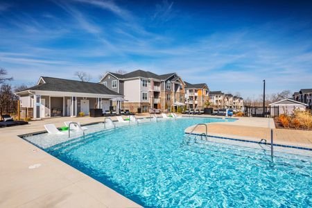exterior pool and apartment building on sunny day