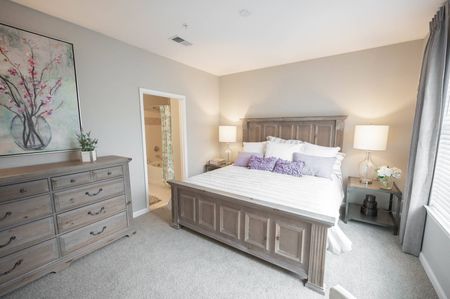 Three-BR Apartments in Duluth, GA - Parc 85 - Furnished Bedroom with Plush Carpeting, and In-Suite Bathroom.