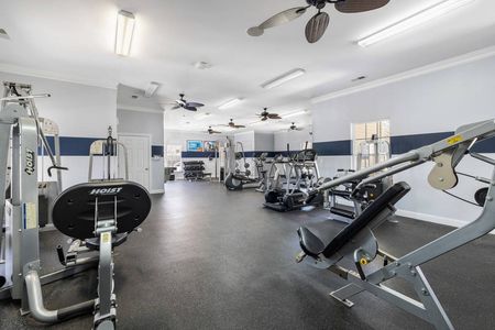Apartment gym with fitness machines and cardio