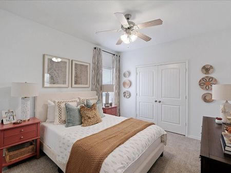 furnished bedroom with carpet